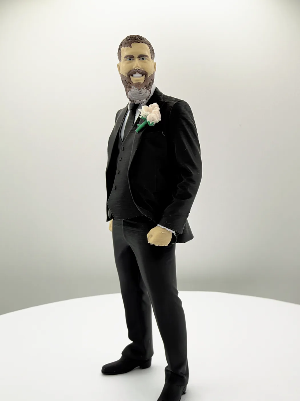 The groom figure at a three-quarter angle, one hand in his pocket